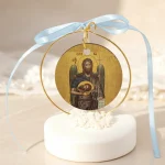 marturie cu icoana sfant pe piatra decorativa alba cu fundita bleu
